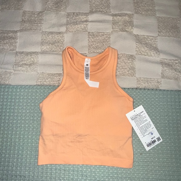 NWT Lululemon Ebb to Street Cropped Racerback Tank
Size 4
Peach Bellini - Picture 1 of 5